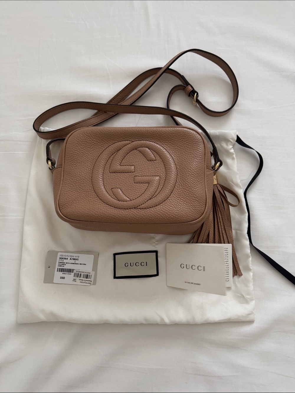 Gucci Pebbled Leather Crossbody Bag in Taupe